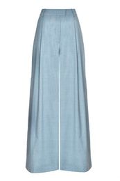 Wide-leg wool trousers in cerulean blue, made in Italy. Featuring a high-waisted, pleated design for a flattering, relaxed fit.