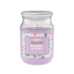 A large, round, glass candle jar with a white lid. The label on the jar features a floral design and the text "Bunny Kisses" indicating the scent of the candle.