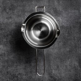 Stainless steel melting bowl for baking, with a round, deep shape.
