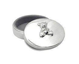 Silver bear-shaped milk tooth box for storing children's baby teeth. Made of durable metal with a secure lid to keep teeth safe.