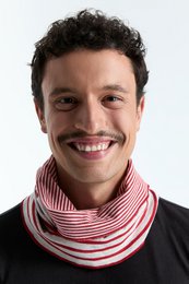  Reversible loop scarf in brick red and beige striped pattern. Unisex design suitable for casual or formal wear. Made of soft, breathable material for comfort.