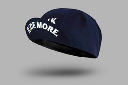  Navy blue cycling cap with "TALK LESS RIDE MORE" text, sporty athletic headwear for cyclists and outdoor enthusiasts.