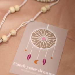  Dreamcatcher wall art for kids' room, featuring a white dreamcatcher design with pink feather accents on a beige background.