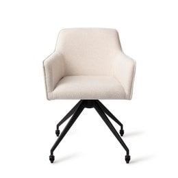 Upholstered dining chair with swivel base in beige fabric. Features a curved backrest and armrests for comfort. Suitable for use in dining rooms or home offices.