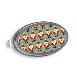 Oval-shaped designer magnetic phone and key holder with a repeating pattern of Santa Claus faces in red, green, and white. Can be used for purse, car, or home organization.