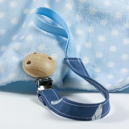 Pacifier clip with feather design, available in various colors including blue, pink, yellow, and wood. The clip features a wooden bead and a blue ribbon.