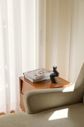  Tall, cylindrical ceramic candlestick in white or black color, with a simple, minimalist design suitable for modern home decor.