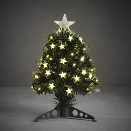 Tall, green artificial Christmas tree with fiber optic lighting and star-shaped ornaments.