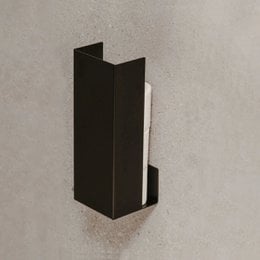 Industrial-style toilet paper holder in black, beige, and white colors. Rectangular shape with a minimalist design. Suitable for modern bathroom decor.