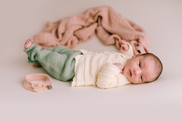 Soft, cozy pink diamond baby blanket for newborn.