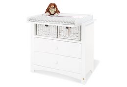White changing unit with two wicker drawers, suitable for baby nursery.