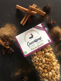 Gourmet caramel popcorn with spices, a sweet and savory snack.