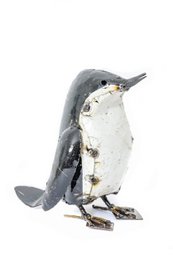  A medium-sized metal penguin figure with a black and white color scheme, featuring a rounded body shape and detailed features.