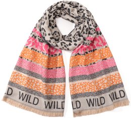  A large, rectangular scarf with a leopard print pattern and colorful striped design. The scarf features the text "WILD WILD" in a bold font.