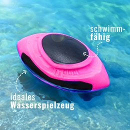  A pink, floating dog toy in the shape of a football. The toy is designed for dogs to play with in the water.