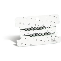 Two black and white charm bracelets with the text "Blondie" and "Brownie" on a white background with heart-shaped patterns.