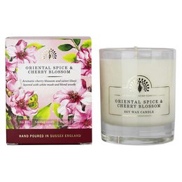 Tall, round scented candle with oriental spice and cherry blossom fragrance, made in England.
