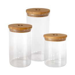 Set of 3 transparent glass storage jars with beige lids in 800 ml, 1000 ml, and 1300 ml sizes. The jars have a simple, minimalist design and are suitable for storing a variety of dry goods such as cereals, grains, or snacks.