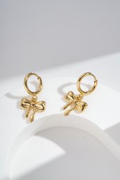  Elegant gold-toned drop earrings with a refined, trendy bow design. Suitable for women.