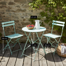 Light green iron garden bistro set with round table and two folding chairs.