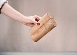 A set of 2 wooden salt and pepper mills with a natural, rustic design. The mills feature a simple, cylindrical shape and are made from high-quality wood materials.