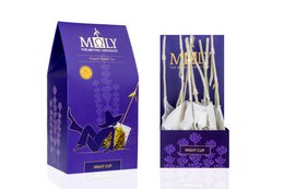 Herbal tea cup with real herbal stem, made of natural materials, in a purple and gold packaging design.