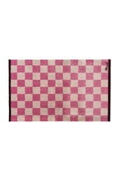 Pink and mauve checkered bath mat, geometric square pattern, rectangular shape, soft textile flooring accessory.