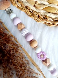 Pacifier clip with daisy and lilac design. Made of soft, durable materials. Suitable for infants and toddlers.