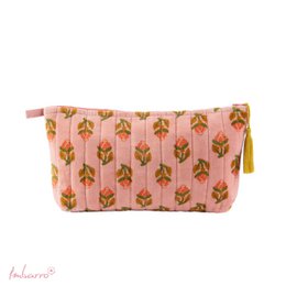  A pink makeup pouch with a repeating floral pattern in shades of orange and yellow. The pouch has a yellow tassel accent.