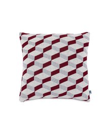 Decorative cushion cover with a geometric pattern in shades of red and white, suitable for use on a couch or chair.
