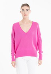  A vibrant pink v-neck sweater with a relaxed, oversized fit, perfect for casual or dressy occasions.