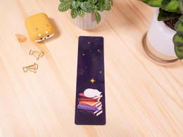  Sleeping Cat TBR Laminated Bookmark, a whimsical book marker featuring a sleeping cat against a starry night sky backdrop, made of laminated material for durability.