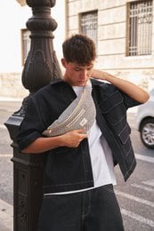 Stylish shoulder bag with a woven pattern and gold-tone hardware.