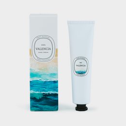 Natural hand cream with citrus fragrance from the Valencia Collection. Moisturizing hand cream in a tube with a colorful, abstract design.