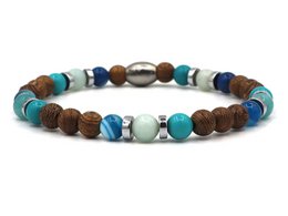  Beaded bracelet with mixed brown and gold-toned beads.

The ENAM Campur Naturel bracelet features a mix of brown and gold-toned beads in a variety of shapes and sizes, including round, oval, and cylindrical beads. The bracelet is available in three size options: XS-S, M-L, and XL-XXL, and in two color variations: silver and gold. The beads appear to be made of natural materials, creating a rustic, earthy aesthetic.