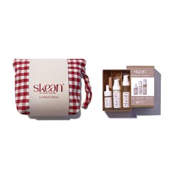  This limited edition Christmas set contains a travel-sized beauty routine, including face treatments in a red and white gingham-patterned pouch.