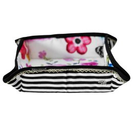 Striped bread basket with floral accents, suitable for storing and displaying bread or other baked goods.