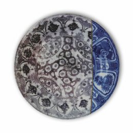 A round ceramic plate with a unique kintsugi-inspired design featuring a mix of gray, white, and blue colors. The plate has an intricate pattern of circles, dots, and abstract shapes that give it a modern and artistic appearance.