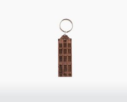 Walnut keychain with Amsterdam Canal House design, featuring a rectangular shape and a metal ring for attaching to keys.