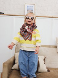  "Apricot orange patterned scarf, 100cm, soft fabric, geometric print design, versatile accessory"