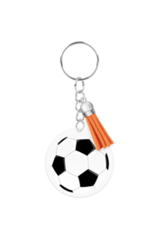 Acrylic keychain in the shape of a soccer ball with an orange tassel.