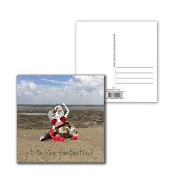 Postcard featuring a beach scene with a floral arrangement and the text "Fantastic" written in the sand.