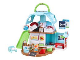  Colorful plastic playhouse with various rooms and accessories, including a fox-shaped character.