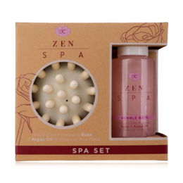 A spa set featuring a round, white bath bomb and a pink glass bottle. The set is designed for relaxation and self-care, with a focus on natural ingredients like roos and argan.