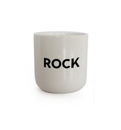 A white ceramic mug with the text "ROCK" printed on it. The mug has a simple, minimalist design.