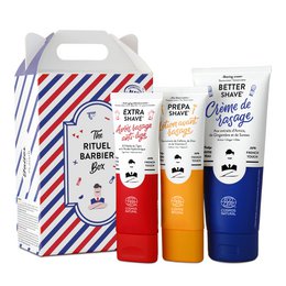 A shaving set for men containing a red, orange, and blue tube of shaving cream or gel, packaged in a striped box with the title "THE RITUEL BARBIER BOX - Shaving Set for Men". The product is categorized as Beard Care.
