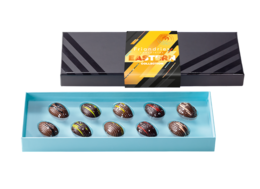  "Chocolate praline bonbons, assorted flavors, elegant gift box packaging, brown chocolate pieces"