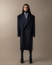 A long, double-breasted navy blue coat with a classic tailored silhouette, suitable for women's winter wear.