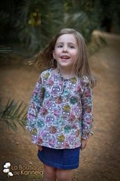  A colorful floral print children's denim skirt for girls, available in sizes 2, 4, 6, 8, and 10.