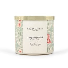 Scented candle with ylang ylang and musk fragrance, in a decorative glass container with a floral design. The candle is part of the Laura Ashley home fragrance collection.